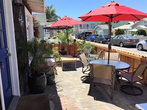 Shared patio includes two seating areas and natural gas BBQ. Patio closes @ 10PM