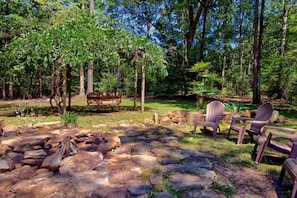Relax on the swing & enjoy our beautiful stone fire pit.