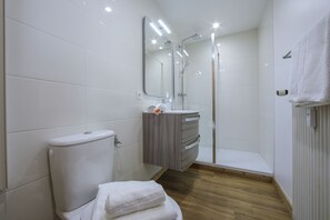 Bathroom with a shower and a toilet