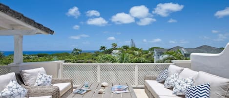 Sun terrace with comfortable seating and stunning sea views 