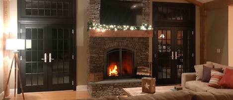 Stacked-stone fireplace and french doors.