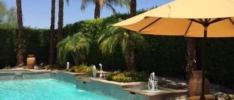 The perfect retreat - blue skies, sparkling pool, inviting chaises and privacy.