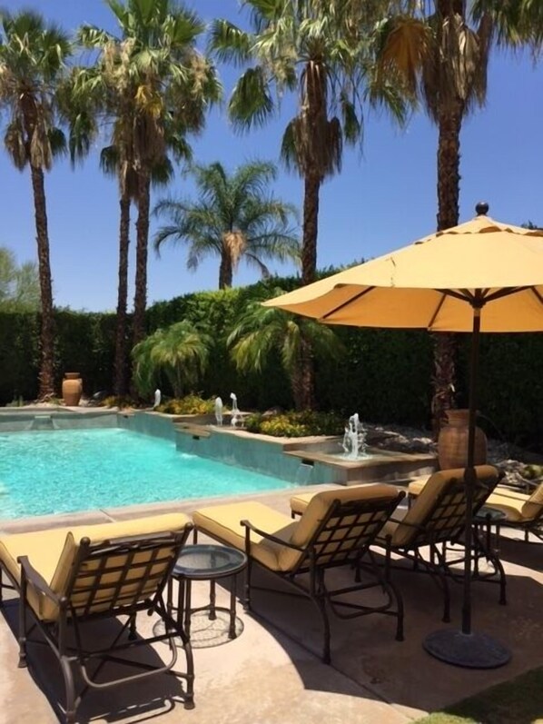 The perfect retreat - blue skies, sparkling pool, inviting chaises and privacy.