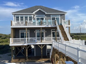 Bedrooms, wet bar, and living area have easy access to majestic ocean views 