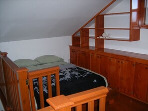 Queen bed in loft