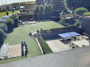 Garden with patio dining, sofas, chess, trampoline, table tennis & play frame
