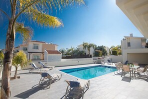 Garden with barbecue, seating area, sun loungers and private pool