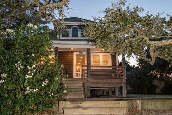 Entrance and East Side Deck Among Live Oaks