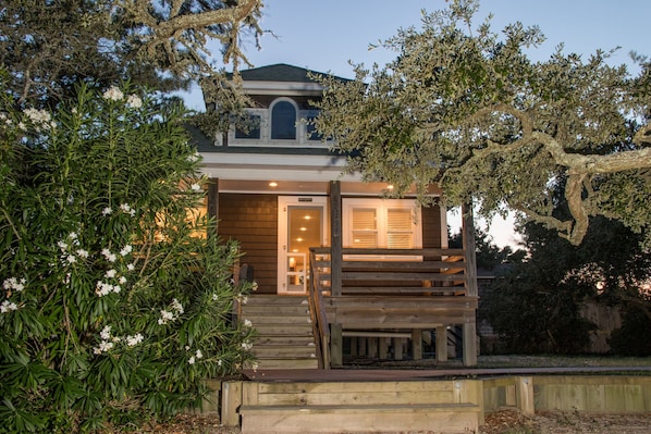 Entrance and East Side Deck Among Live Oaks