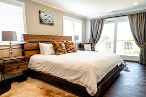 Primary Bedroom with King Bed and Waterfront Deck Access