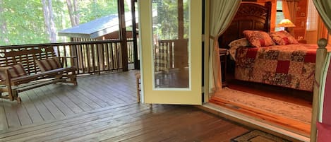 Porch, glider, and hot tub gazebo beyond