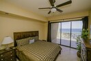 Master bedroom with sliders to the 40' deck, flat screen TV, DVD player 