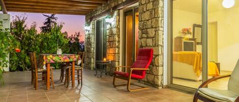 Patio with a table and arm chairs