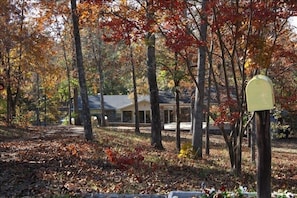 View of house in the fall from Old Duncan Bridge Road.