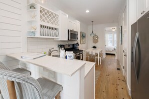 Kitchen with stainless steel range, dishwasher and refrigerator