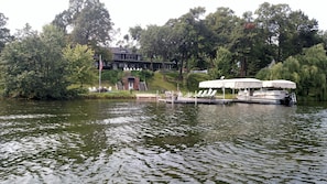 A view from the lake of the gorgeous house and grounds.