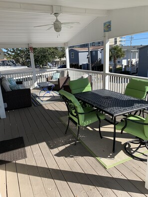 Outdoor dining area on covered front deck.