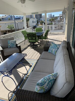 Outdoor living space on covered front deck.