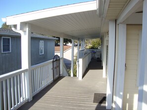 Covered side and rear deck with new stairway