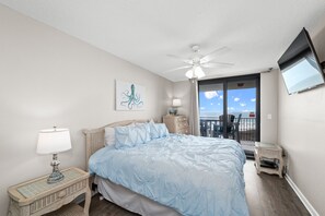 Master Bedroom with King Size Bed and Private Balcony Access