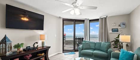 Spacious Living Area with plenty of comfortable seating and direct balcony access so you can enjoy views of the gulf from almost everywhere!