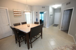 Open dining area with easy access to living room and bedrooms