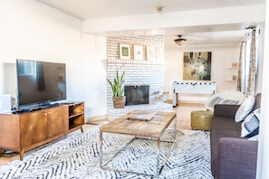 Downstairs rec/family room. Note: fireplace is inoperable.