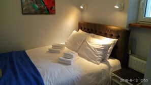 Bedroom. The bed is custom made wall-to-wall: 200 cm long and 140 cm wide.