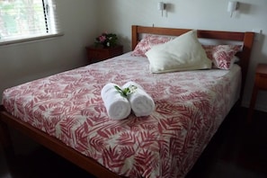 second bedroom with queen bed next to 2nd bathroom