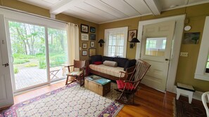Living room with slider to front deck