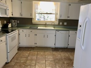 Kitchen has plenty of space for many cooks! Reverse osmosis water filter at tap.