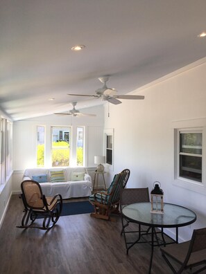 Newly Remodeled large three season porch with plenty of seating and dining 