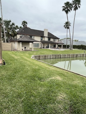 Back view
Heated pool, hot tub, slide and outdoor dining!