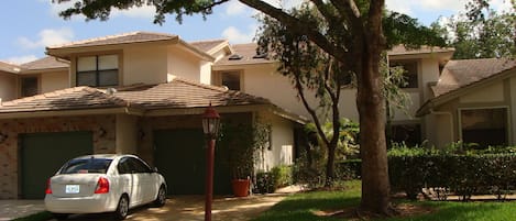 House front view single car garage and driveway for additional 2 cars