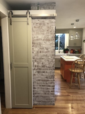 Barn door chic with five shelf storage for your convenience!