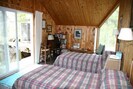 Inside of bungalow set of with twin beds.  They can converted to a King.