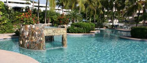 Pool with Grotto and Waterfall. The pool is 3-4 feet deep - perfect for the kids