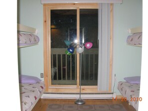 View of 2nd bedroom from hallway entrance.