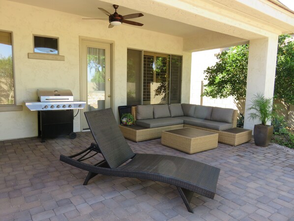 Sit back, relax, enjoy our backyard under the covered patio!