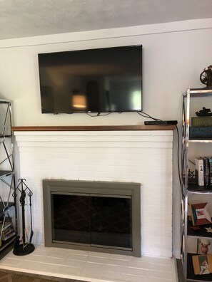 Updated (May 2020)  wood burning fireplace, and 50 inch flat screen.