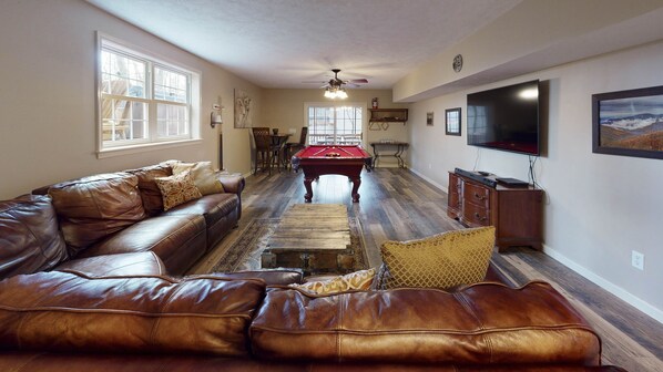 back deck with hot tub and grill