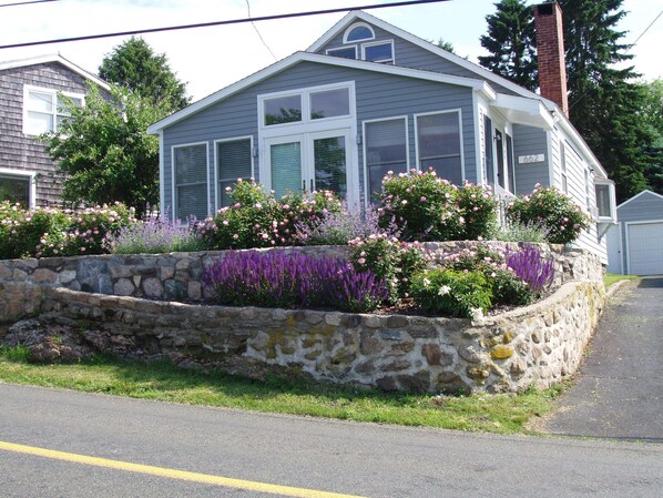 Exterior view of cottage front from road.