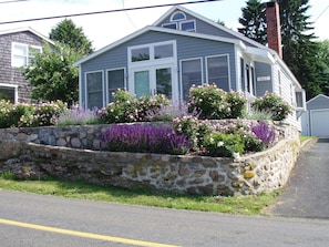 Exterior view of cottage front from road.