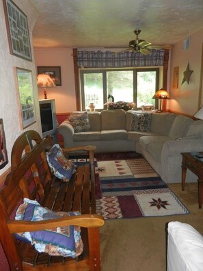 Includes a comfy sectional sofa and 35” television.   Toy area for kids.