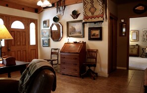 Font entrance with a glimpse of the master bedroom