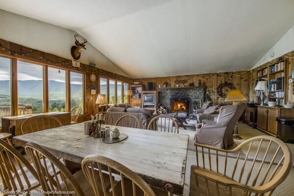 Looking from grand kitchen into living room with Sugarbush MT view out window