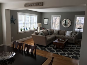 Newly refreshed living area with new paint, rugs, accessories