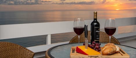 Enjoy romantic sunsets while you wind down with a glass of wine on the balcony. 