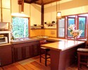 Light and open kitchen with tropical breeze and views