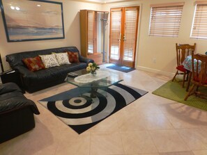 Living room view with the entrance door